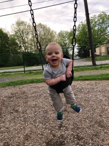 Baby on a swing in a park